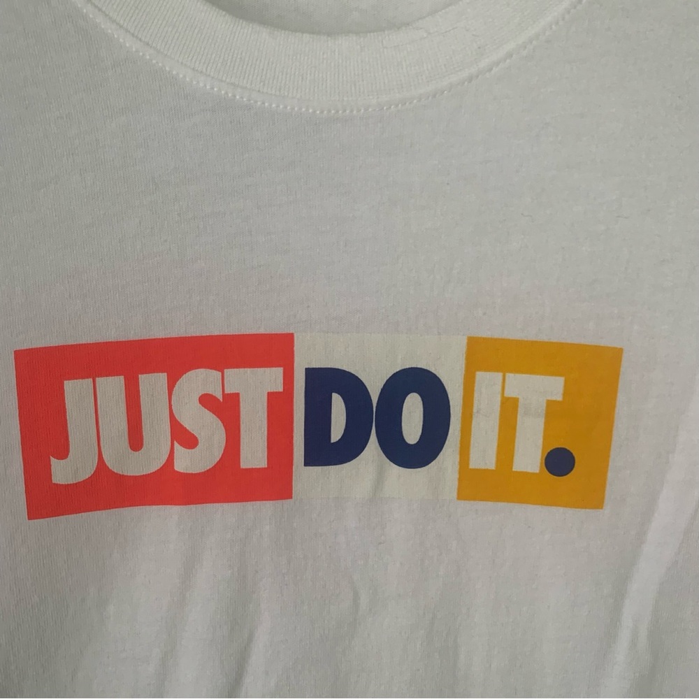 Nike White Tee (L) w/Orange, Blue & Yellow “Just Do It”